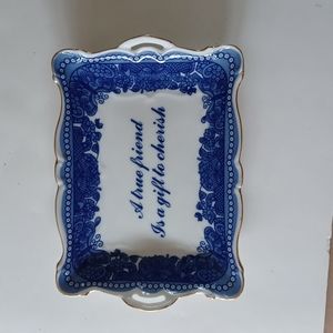 Blue and white trinket dish with gold trim